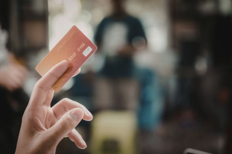 person holding a credit card