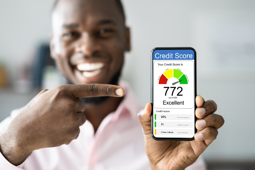 guy pointing at phone with score