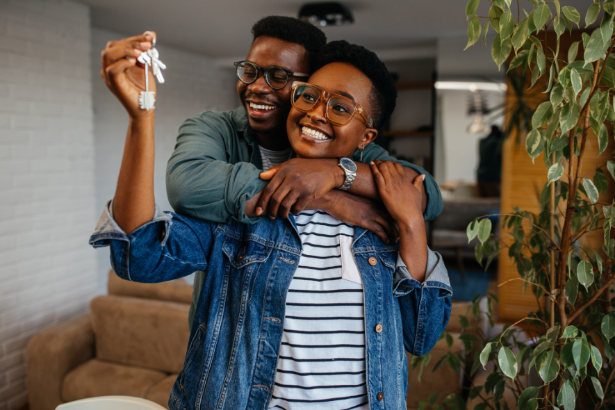 happy couple with home keys